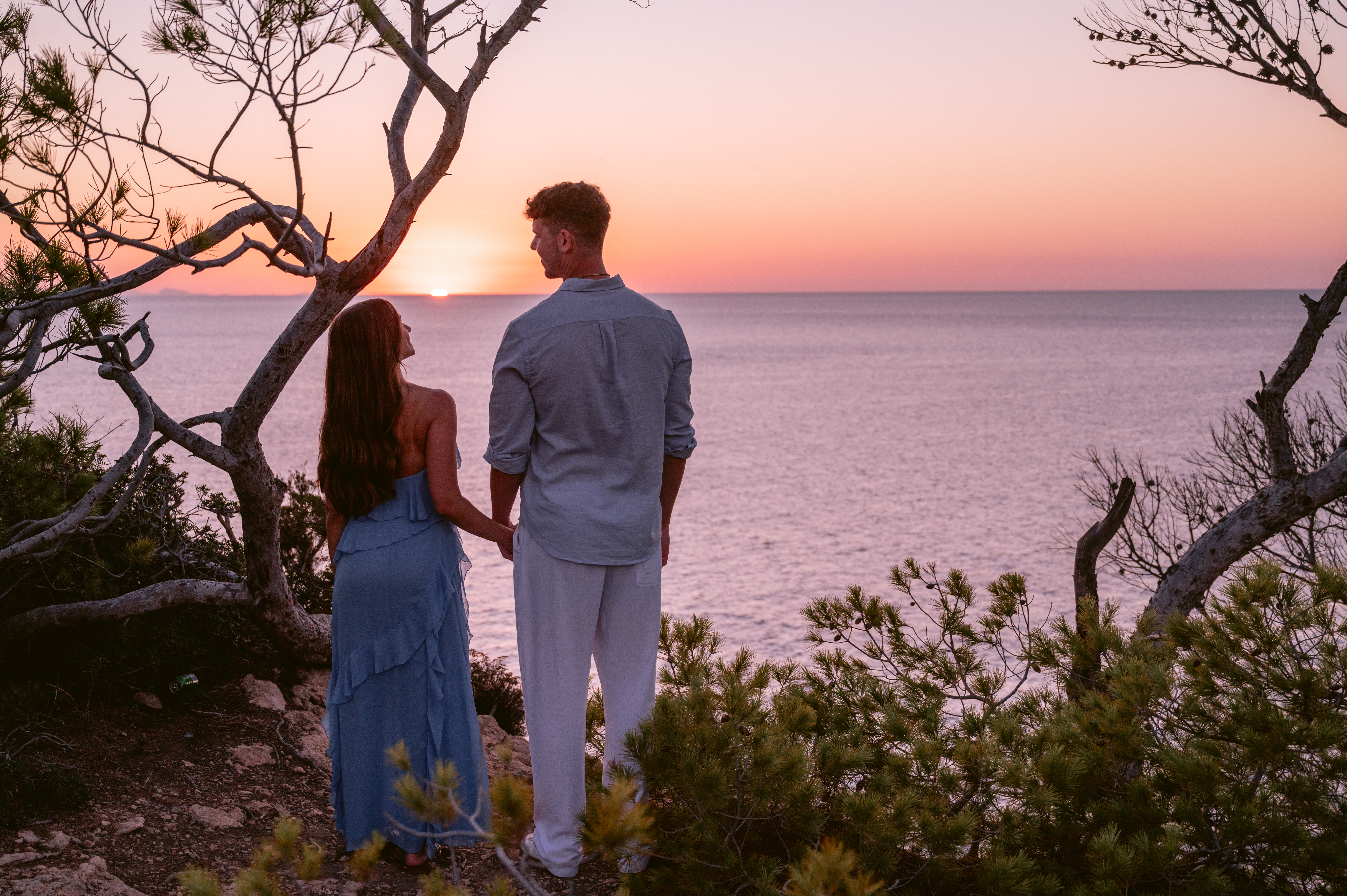 Holding hands watching the Ibiza sunset
