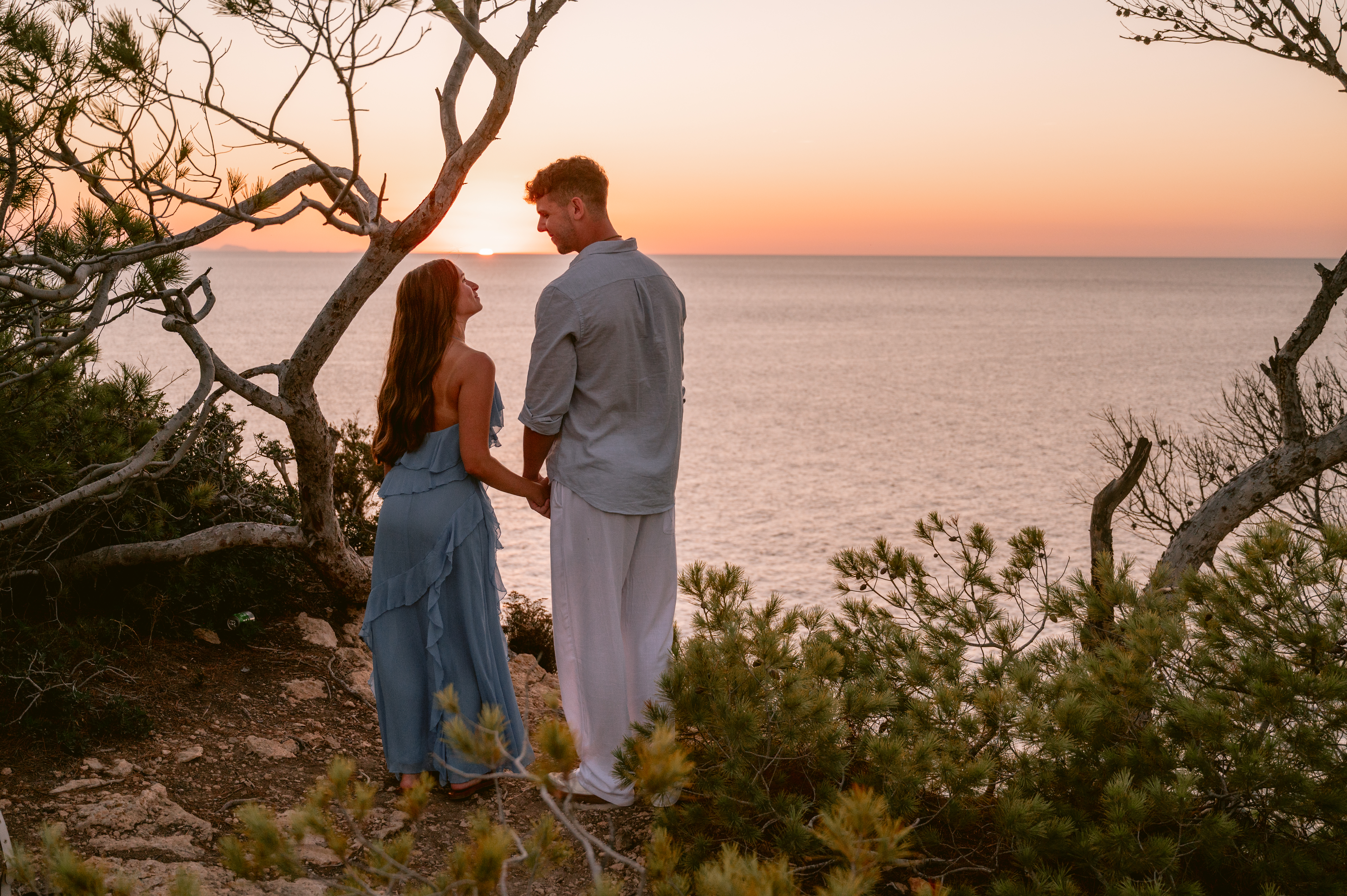 Looking at each other at sunset